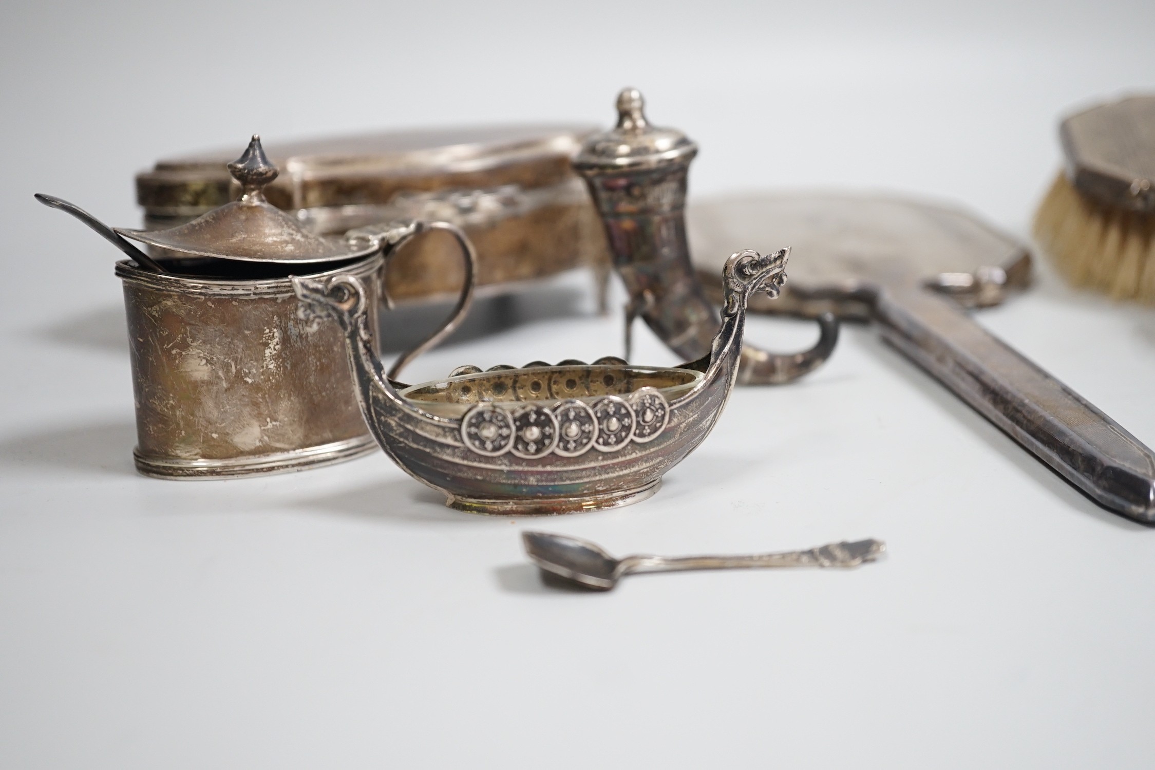 A George V silver mounted trinket box, Elkington & Co, Birmingham, 1918, 13.1cm, a silver mustard pot, two Scandinavian 925 condiments, two silver mounted scent bottles, hatpins and hatpin stand and a silver mounted thre